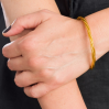 Bracelet bouddhiste - or - torsadé - M