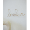 Mot en laiton doré - bonheur