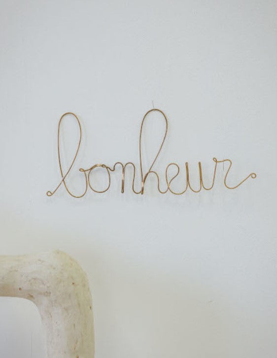 Mot en laiton doré - bonheur