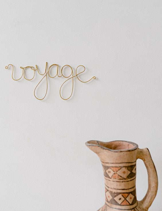 Mot en laiton doré - voyage